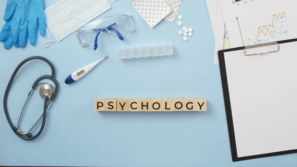 On Medical Table is Composed the Word Psychology of Wooden Cubes with Letters the View From Above