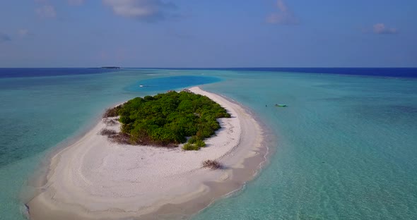 Tropical aerial clean view of a white sand paradise beach and blue water background in colourful 4K