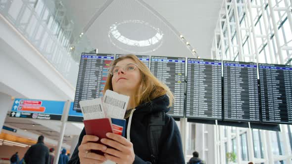 Young Woman Travel Abroad. Tourist Go Home Airport