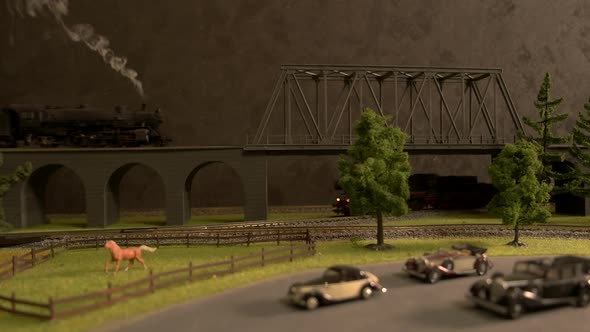 Model of Steam Locomotive Train Crossing the Bridge.