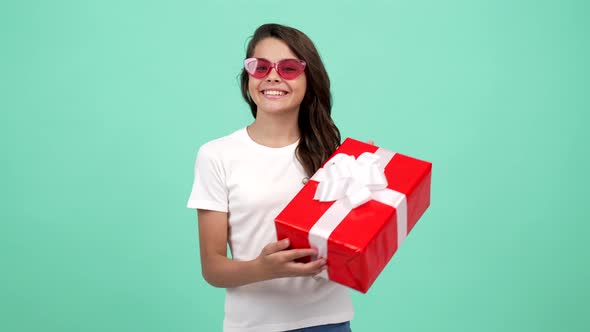 Happy Teen Girl in Sunglasses Hold Present Box Purchase
