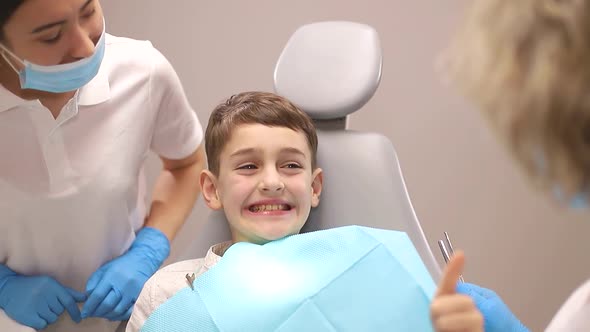 Little boy treats teeth, dentists examine a child's teeth, the concept of dentistry