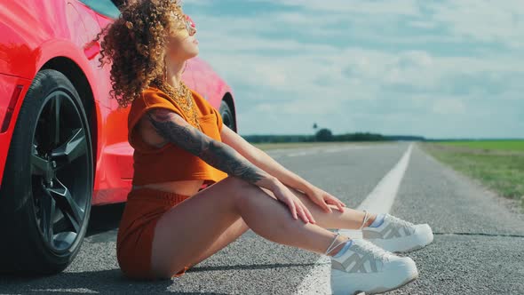 Beautiful Model Woman Tattoo Is Posing Red Car Summer Landscape