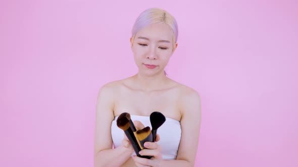 Asian woman choosing many blushes type cosmetic tool for new rookie beauty blocker