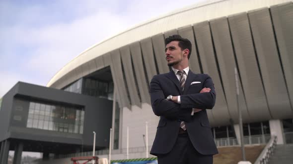 Businessman arranging his jacket