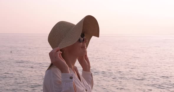 Woman Enjoy the Sunset in Hat