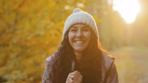 Closeup Young Pretty Hispanic Woman Looking at Camera Smiling Beside Herself with Happiness