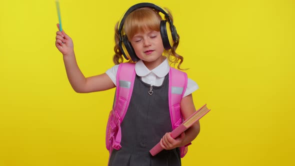 Pretty Smiling Girl in School Uniform Listening Music Via Headphones Dancing Disco Fooling Around
