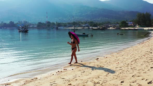 Beautiful Smiling Girls on Holiday by The Sea on Beach on Summer White Sand and Blue