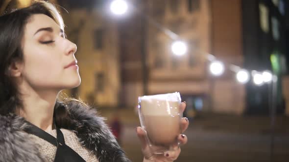 Woman with Big Mug of Hot Drink During Cold Day