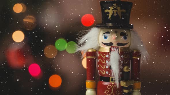 Falling snow with nutcracker Christmas decoration alt