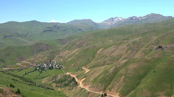 A Small Village Among The Barren Steppe Treeless Mountains