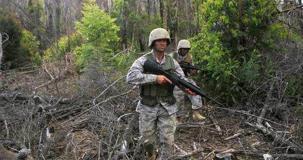 Military soldiers during training exercise with weapon alt