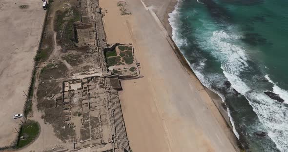 Aerial footage of the ancient remains of the coastal city of Caesarea, built under Herod the Great d