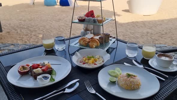 Breakfast on the Beach in Thailand a Luxury Breakfast Table with Food and Beautiful Tropical Sea