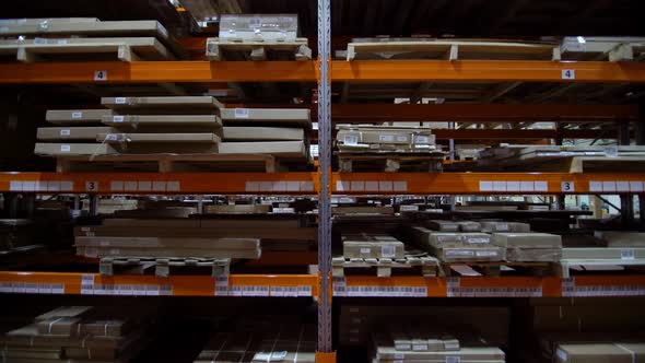 Shelves with Goods in Cardboard Boxes and Packages Full of in Retail Warehouse