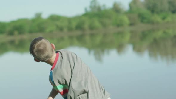 Boy throwing stones