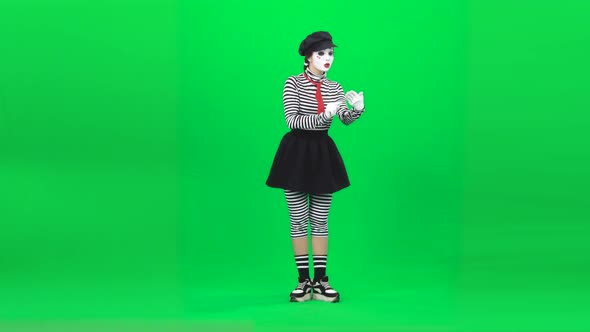 Mime Girl Evaluating Something on Tablet . Chroma Key