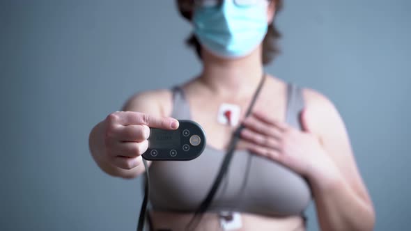 Woman with Sensors of Holter Monitor Device for Daily Monitoring of an Electrocardiogram on Her Body