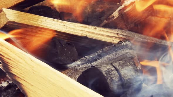 Burning wood logs for a barbecue