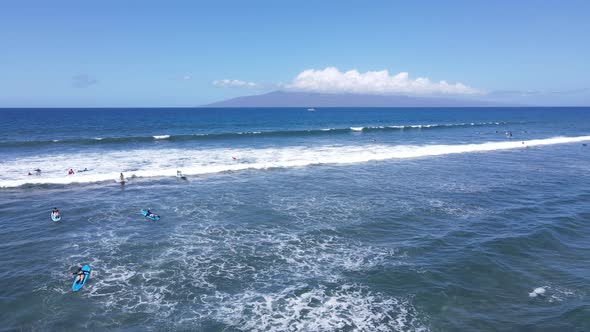 Aerial View of Surfers and Waves in Crystal Blue Ocean in Maui Hawaii