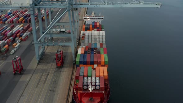 Top a Container Ship Tower Crane Forklifts and the Calm Sea Waters