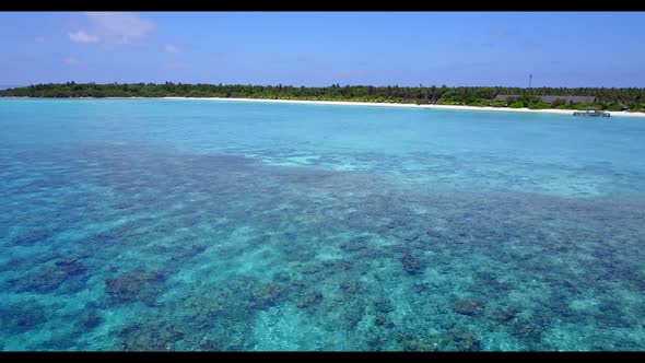 Aerial scenery of paradise coastline beach time by shallow sea with white sandy background of a dayt