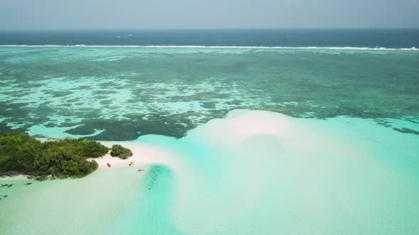 Aerial Drone Video of an Abandoned Island with a Sandbar in Maldives