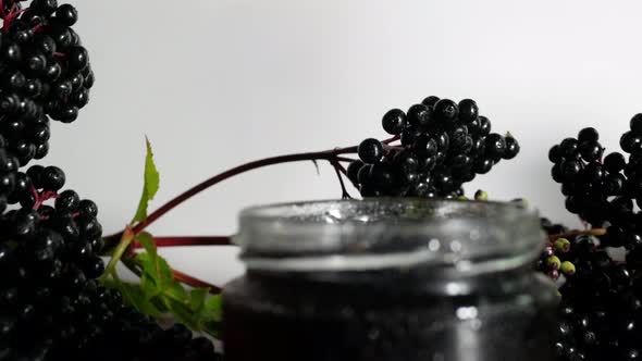 Slow Motion Natural Black Elderberry With Squeezed Juice In A Jar, Homeopathy Treatment With