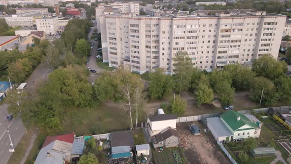 Bird'seye View of a City Street with a Highrise Building and Small Buildings