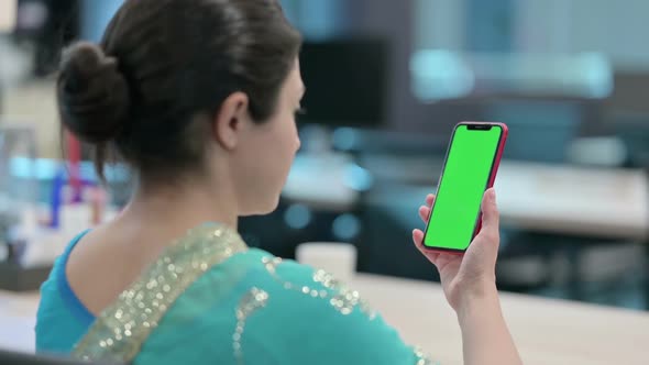 Indian Woman using Smartphone with Chroma Key Screen