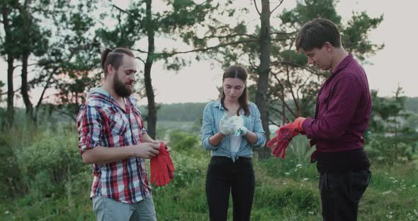 Happy Team of Volunteers Talk Wear Gloves and Have a Fun on Nature