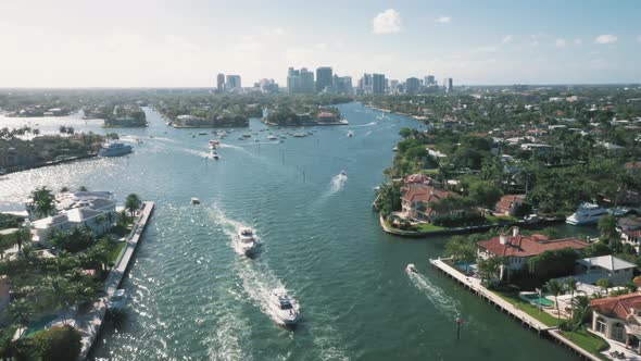 Boats Passing Through New River In Fort Lauderdale, Florida, USA. - aerial