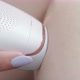 Woman doing hair removal with laser epilator. Cosmetic procedures at home. Laser hair removal - VideoHive Item for Sale