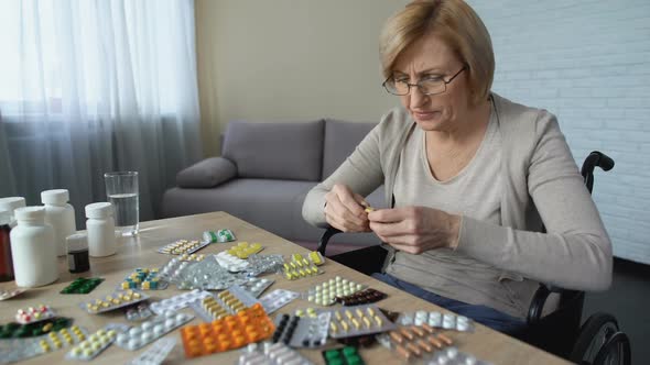 Sad Old Woman Throwing Pills Off Table and Crying, Health Problem, Depression