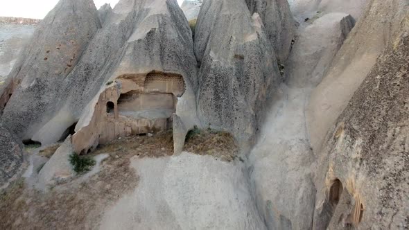 Hoodoos, Fairy Chimneys and Historical Cave Houses in Sedimentary Volcanic Rock Formations