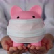 Businesswoman holding piggybank with medical mask - VideoHive Item for Sale