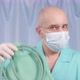A Doctor in a Medical Mask and Rubber Gloves Shows a Large Enema - VideoHive Item for Sale