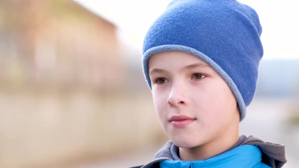 Portrait of Happy Child Boy in Warm Clothes in Autumn Outdoors