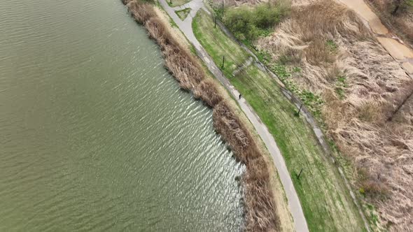 An aerial view over Flushing Meadow Corona Park in Queens, NY on a sunny day. The drone camera dolly