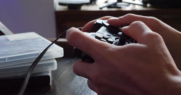 A professional esports player with a videogame controller during a competitive gaming match.