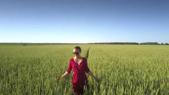 Flycam Films Lady Wearing Short Red Dress and Sunglasses