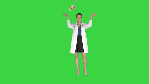 Doctor with Money Woman Doctor Throwing Money and Making a Pose on a Green Screen, Chroma Key