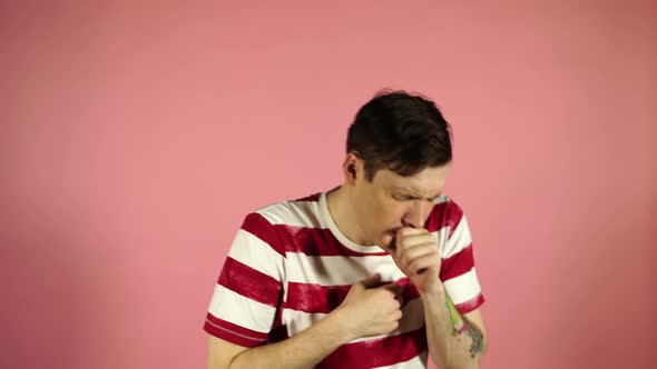 Man Cough Standing on Pink Background. Feeling Unwell or Ill