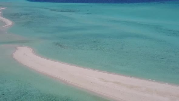 Aerial drone seascape of coastline beach by blue water with sand background