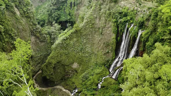 Drone Pulling Back Over Tumpak Sewu Waterfalls