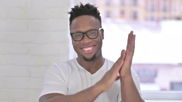 Portrait of Successful Casual African Man Clapping