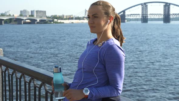 Woman Shifts Her Gaze at the Riverwalk