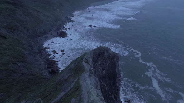 The drone flies around a cliff, aerial veiw of Pacific Ocean (Humboldt Lagoons, California, USA)