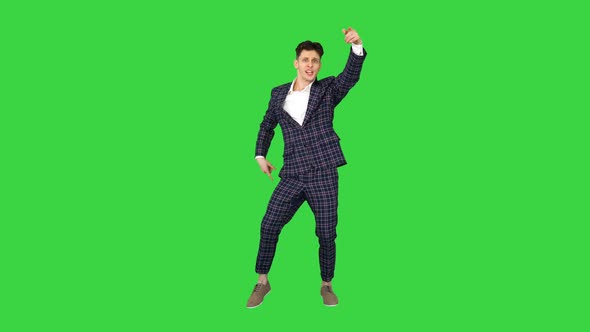 Happy Successful Businessman Dancing In a Crazy Way on a Green Screen, Chroma Key